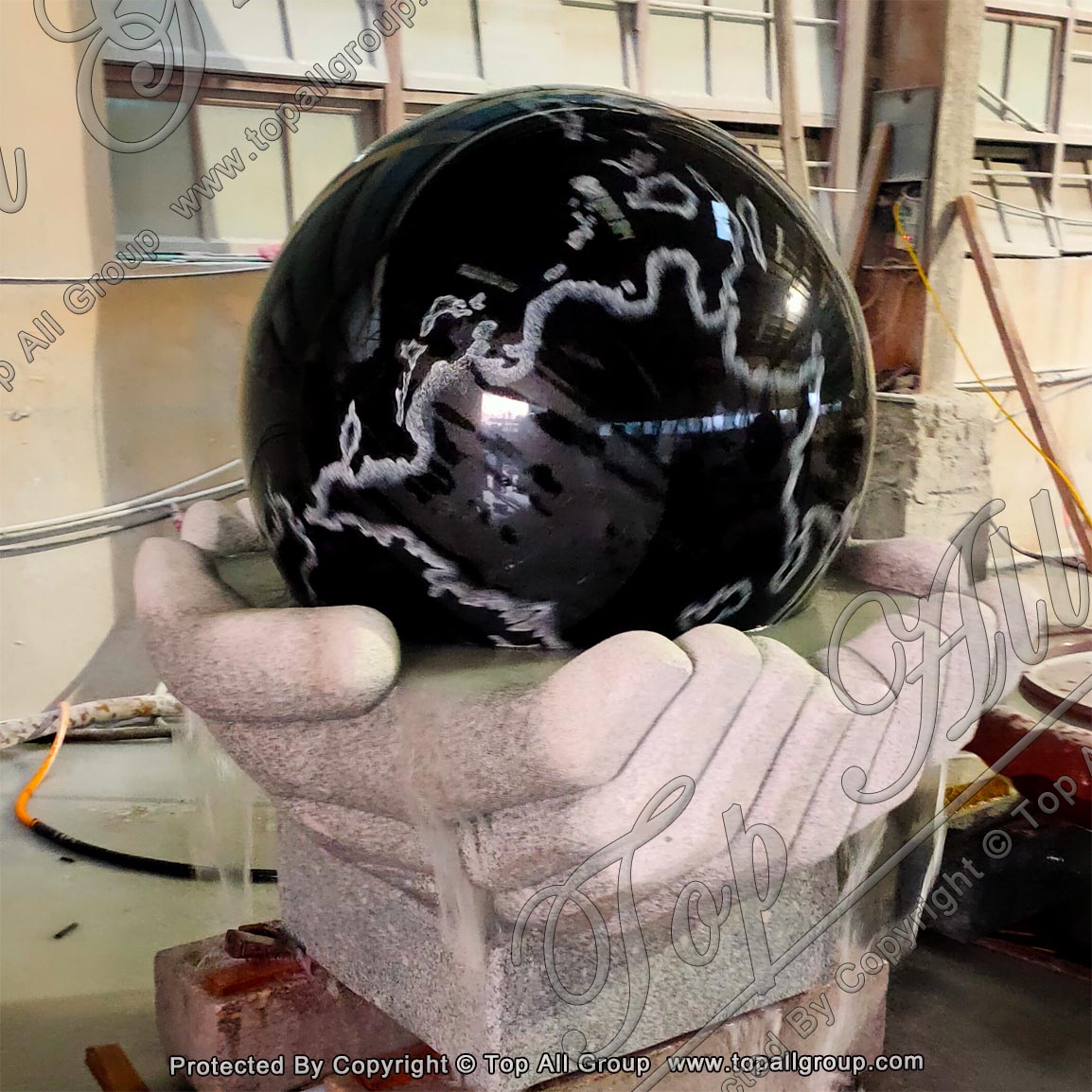 Black Granite Sphere In Both Hand Base Fountain