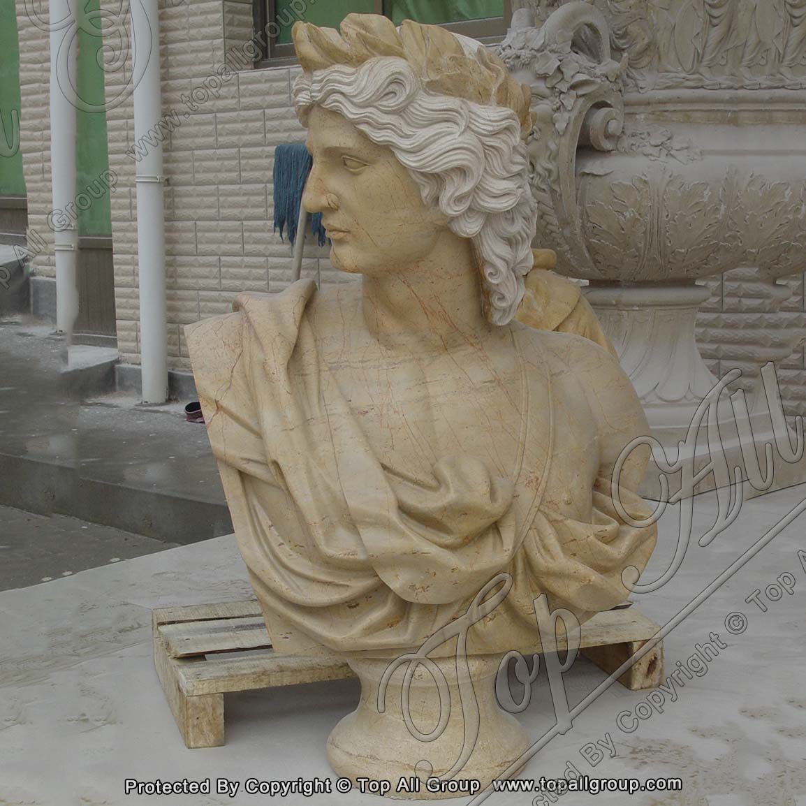 Yellow marble bust statue